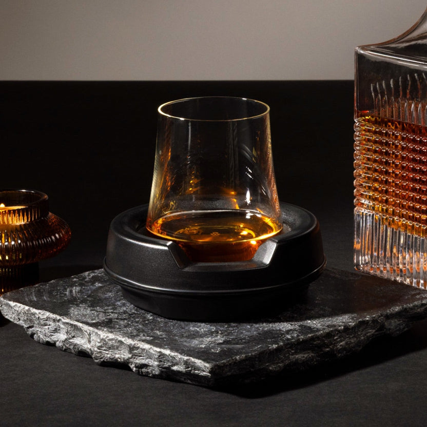 Whiskey in the VoChill Spirits Chiller on a black slate with dark background