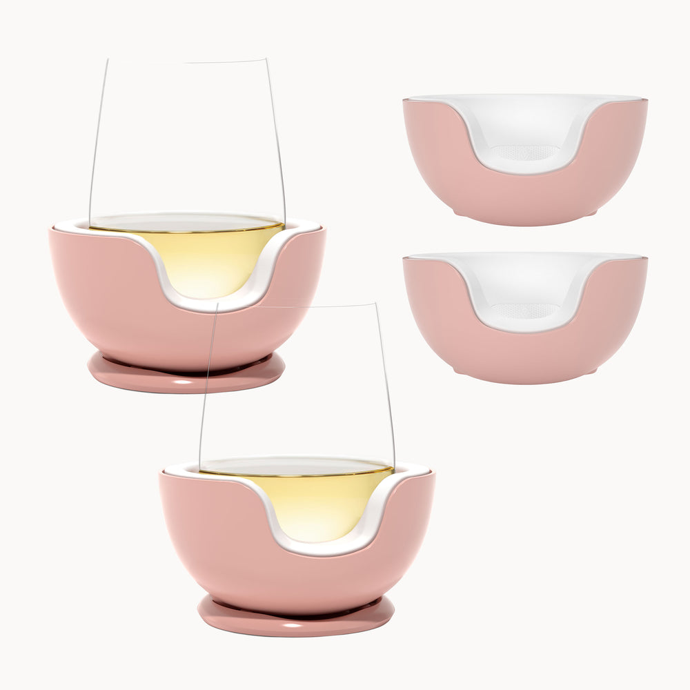 two stemless wines glass chillers in rose color against a white background