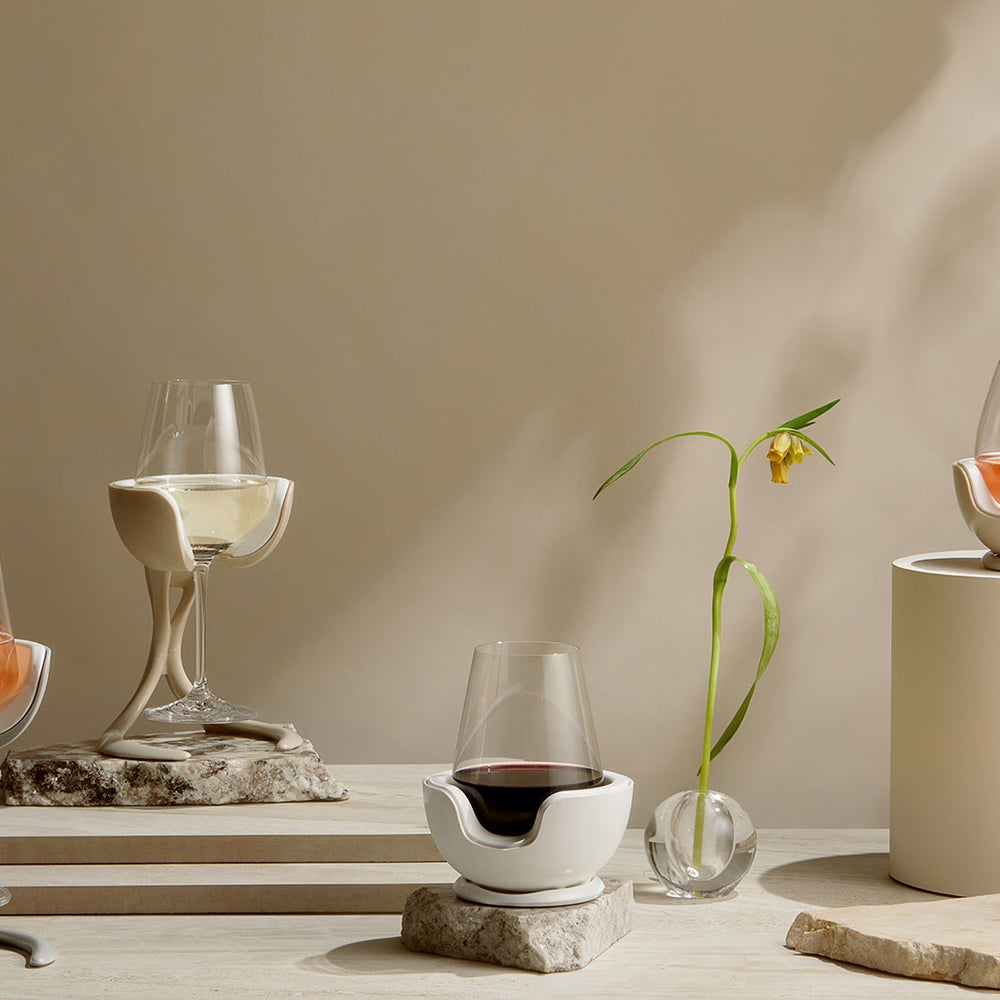 Stemmed and stemless VoChill wine chillers with white, rosé, and red wine in a still life setting