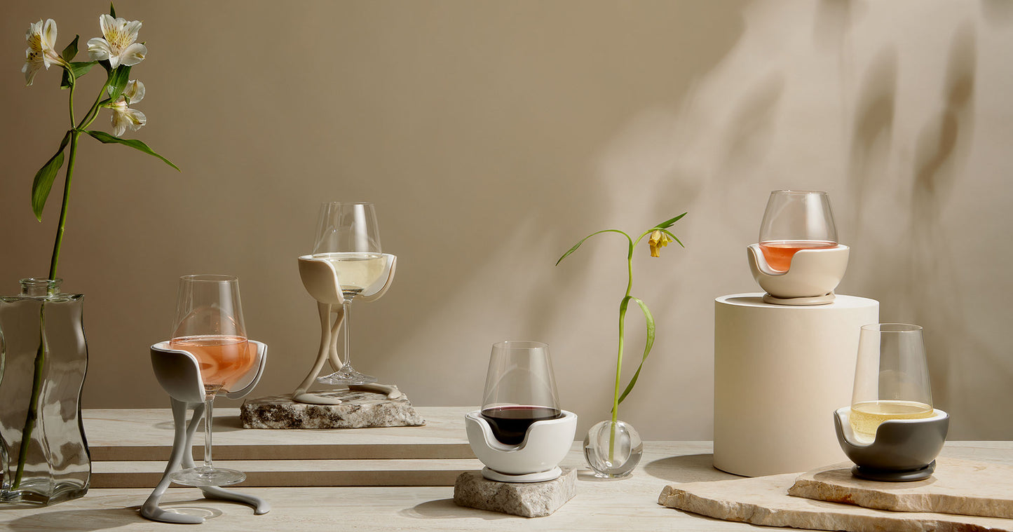 Stemmed and stemless VoChill wine chillers with white, rosé, and red wine in a still life setting